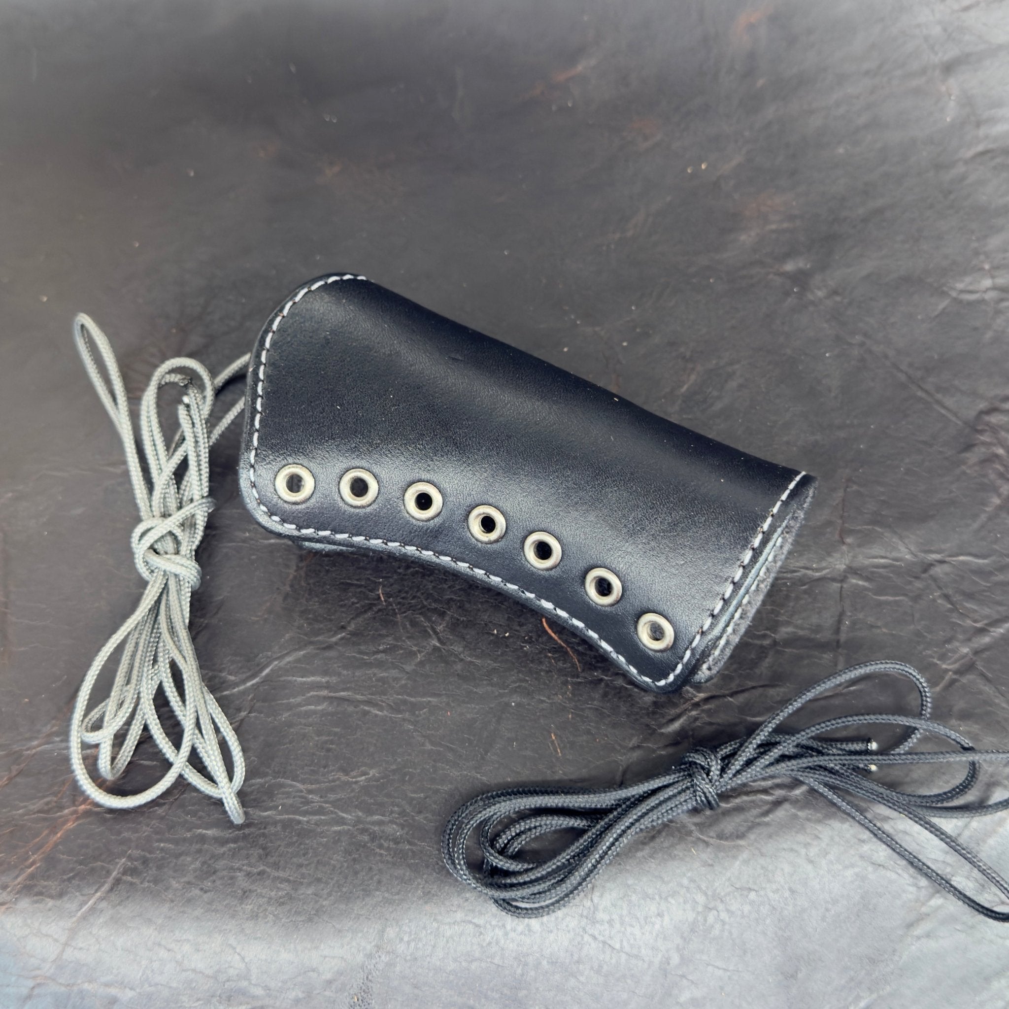*In Stock* Shockwave Raptor Grip Wrap – Mossberg 500/590 Black Leather w/Antique Nickel Eyelets