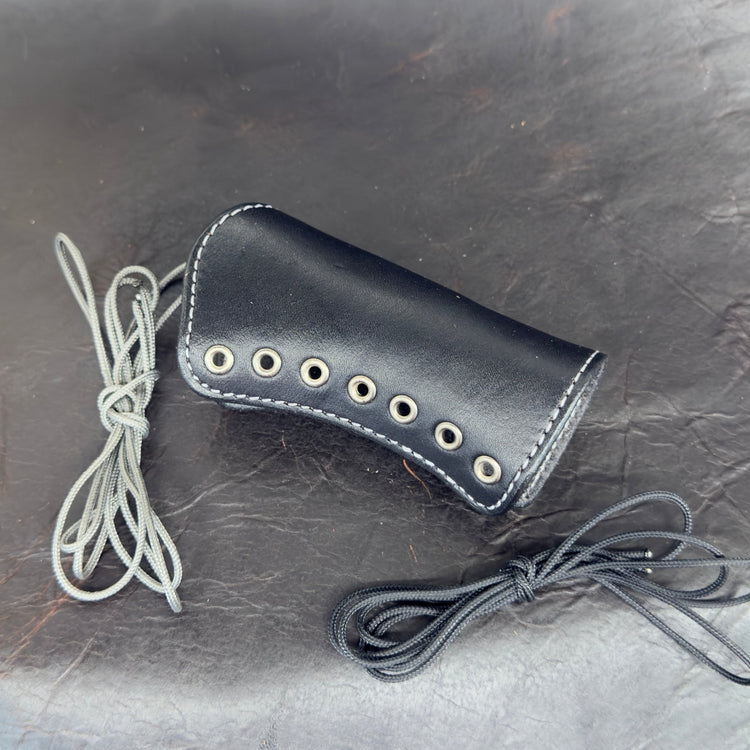 *In Stock* Shockwave Raptor Grip Wrap – Mossberg 500/590 Black Leather w/Antique Nickel Eyelets